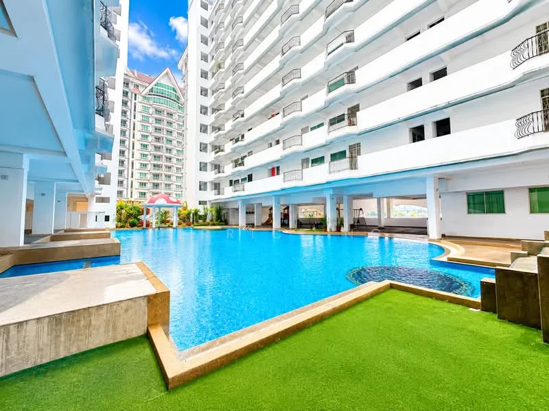 Exterior type: mid-rise condominium; features: swimming pool, pool deck with loungers, manicured lawn, white painted facade, balconies with railings, landscaped garden, covered parking area, water feature, surrounded by greenery; style: modern.