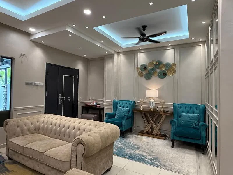 Living features: beige tufted sofa, two teal armchairs, coffee table with X-shaped base, area rug with abstract pattern, tray ceiling with recessed lighting, 5-blade ceiling fan, wall-mounted decorative art, wall paneling, white painted walls, marble tile flooring, table lamp on side table; style: modern.