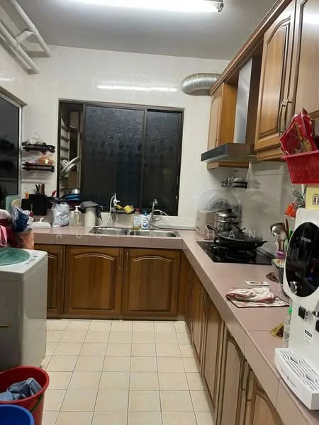 Kitchen features: wood cabinetry, pink laminate countertop, single-bowl stainless-steel sink, chrome pull-down faucet, built-in gas stove, exhaust hood, ceramic tile flooring, window with grid pattern, washing machine, plastic laundry basket, various kitchen utensils and containers.