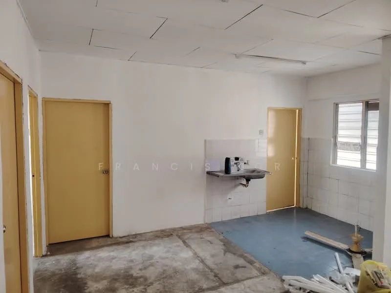 Room features: white painted walls, concrete flooring, two yellow doors, sink with faucet, white tiled backsplash, window with natural light, unfinished ceiling, visible plumbing fixtures; style: minimalist.