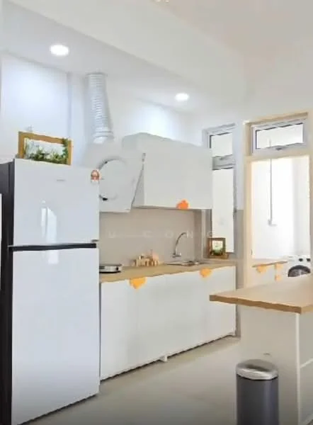 Kitchen features: white cabinetry, wood countertop, stainless-steel sink, chrome pull-down faucet, freestanding fridge, built-in stove, exhaust hood, window with natural light, light grey walls, recessed ceiling lights, open shelving, laundry area visible; style: modern.