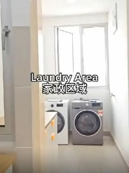 Laundry features: front-load washing machine, front-load dryer, white cabinetry, tile flooring, window for natural light, light-colored walls, countertop space, laundry area signage.