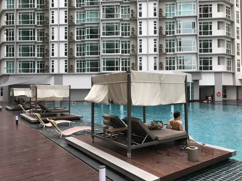 Exterior type: high-rise condominium; features: infinity pool, pool deck with loungers, cabana with canopy, wooden decking around pool, glass curtain wall facade, multiple floors visible, poolside lighting, swimming area, safety buoy; style: modern.