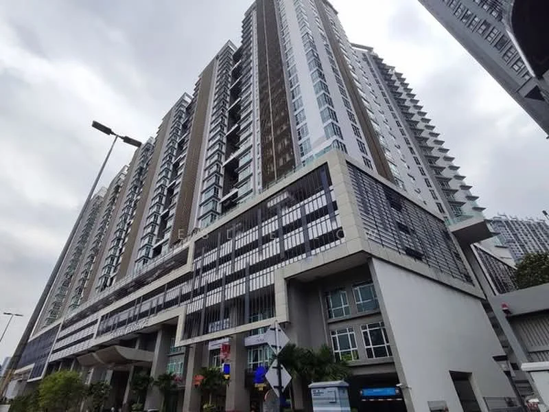 Exterior type: high-rise condominium; features: glass curtain wall, exposed concrete facade, recessed balconies, vertical fins, feature lighting at night, approximately 20-storey high-rise, manicured landscaping, multiple entrances, surrounded by mature greenery, urban context with nearby road; style: modern.