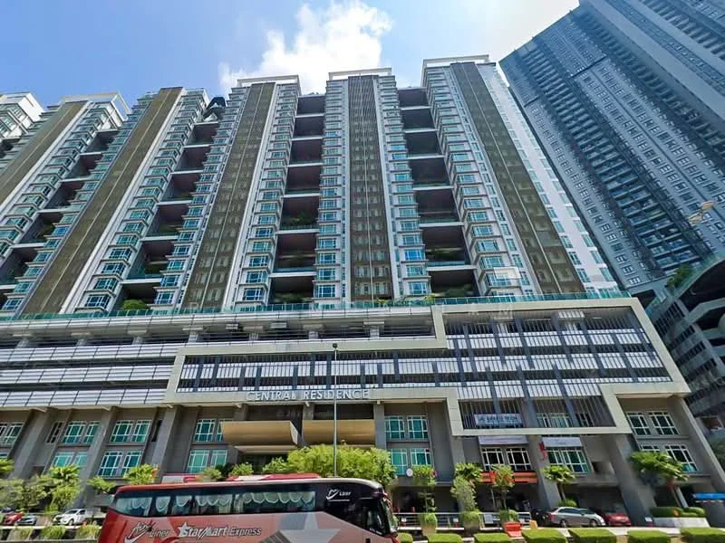 Exterior type: high-rise condominium; features: glass curtain wall, projecting balconies, multiple storeys, commercial space at ground level, landscaped entrance, visible signage, surrounded by urban context; style: modern.