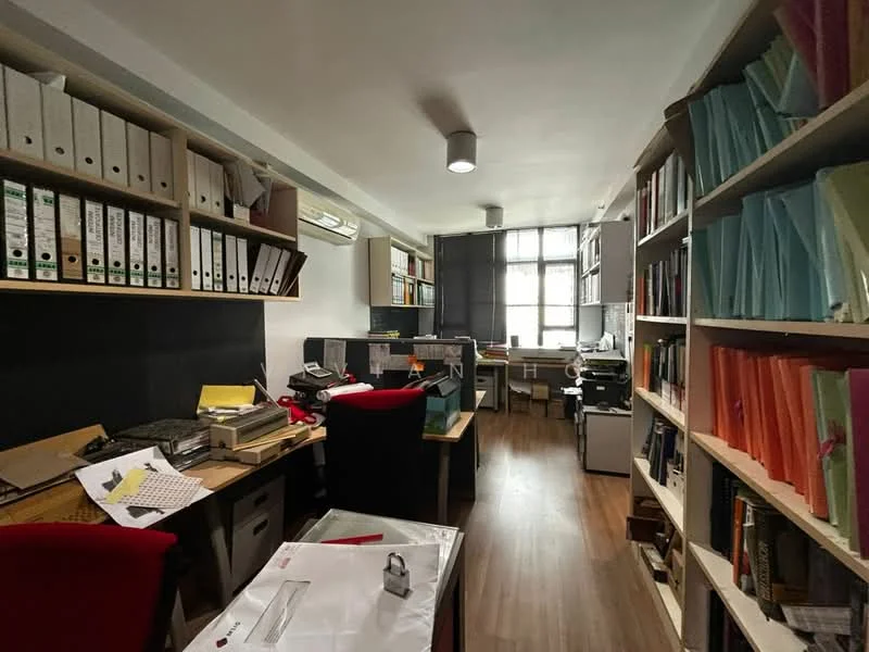 Study features: wood laminate flooring, white painted walls, suspended ceiling with recessed lighting, floor-to-ceiling windows, blackout blinds, built-in bookshelves with colorful file folders, two desks with office chairs, printer, filing cabinets, office supplies scattered on desks, air conditioning unit; style: modern.
