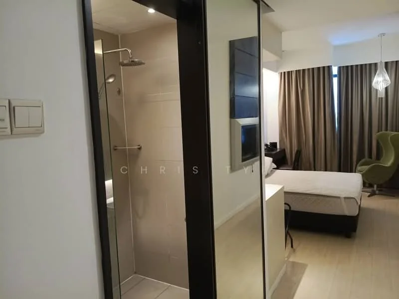 Room features: glass shower enclosure, rain shower head, wall-mounted shower controls, light-colored tile flooring, white walls, large mirror, window with sheer curtains, bed with white bedding, green accent chair, pendant light fixture, curtains, built-in wardrobe; style: modern.