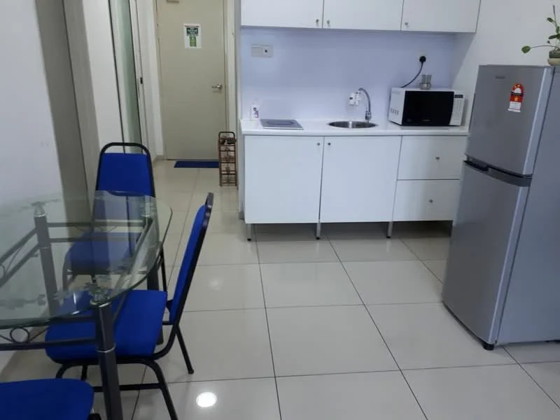 Kitchen features: white cabinetry, stainless-steel sink, chrome faucet, microwave, stainless-steel fridge, glass dining table, blue upholstered dining chairs, ceramic tile flooring, wall-mounted cabinet, countertop space; style: modern.