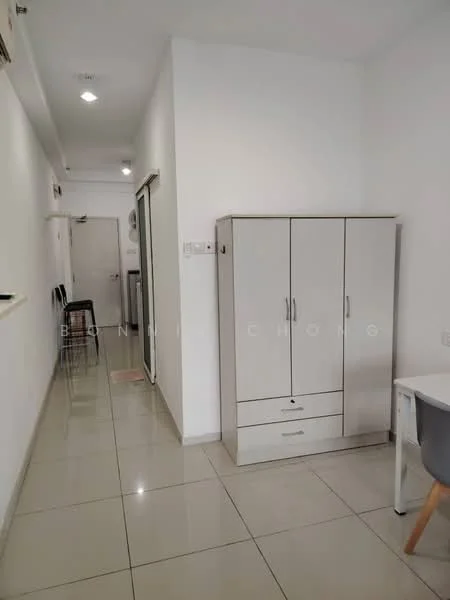 Room features: white painted walls, glossy ceramic tile flooring, recessed downlights, built-in wardrobe with sliding doors, white cabinetry, neutral decor, open hallway, glass door, kitchen area visible in background; style: modern.