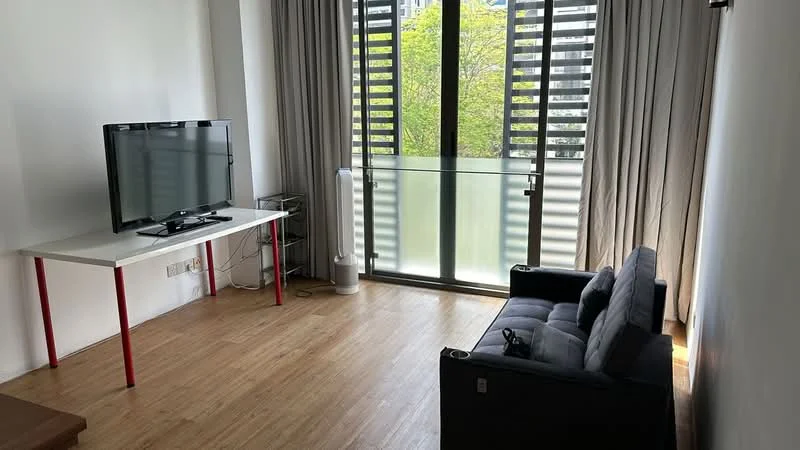 Living features: black fabric sofa, white table with red legs, flat-screen TV on stand, floor-to-ceiling windows, sliding glass door, curtains, wooden flooring, air conditioning unit; style: modern; view: garden.