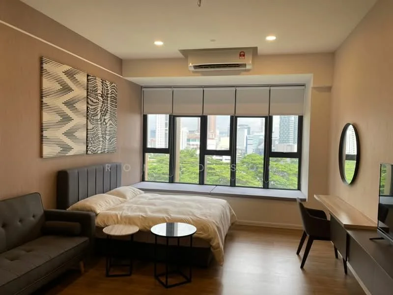 Bedroom features: king-size bed with white bedding, upholstered headboard, 2 black side tables, grey fabric sofa, wall-mounted TV, large windows with city view, roller blinds, wooden flooring, air conditioning unit, decorative artwork on wall, study desk with chair; style: modern; view: city.