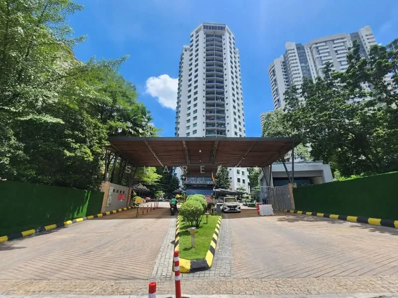 Exterior type: high-rise condominium; features: covered entrance with wooden roof, paved driveway, green perimeter fencing, landscaped greenery, surrounding high-rise buildings, security checkpoint, marked parking spaces; style: modern.