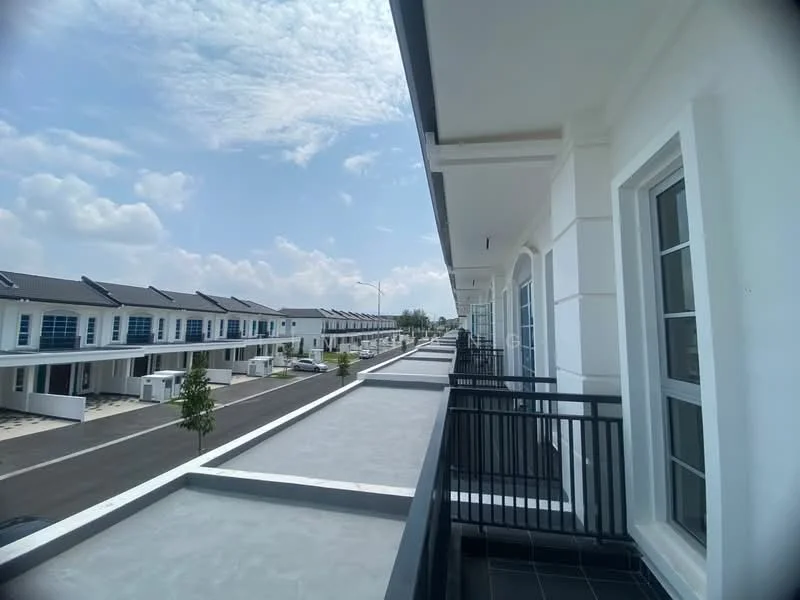 Exterior type: linked terrace house; features: white painted facade, flat roof, 2-storey, balconies with black railings, paved walkway, manicured landscaping, surrounded by mature greenery, parking spaces visible, urban context with clear sky; style: modern.