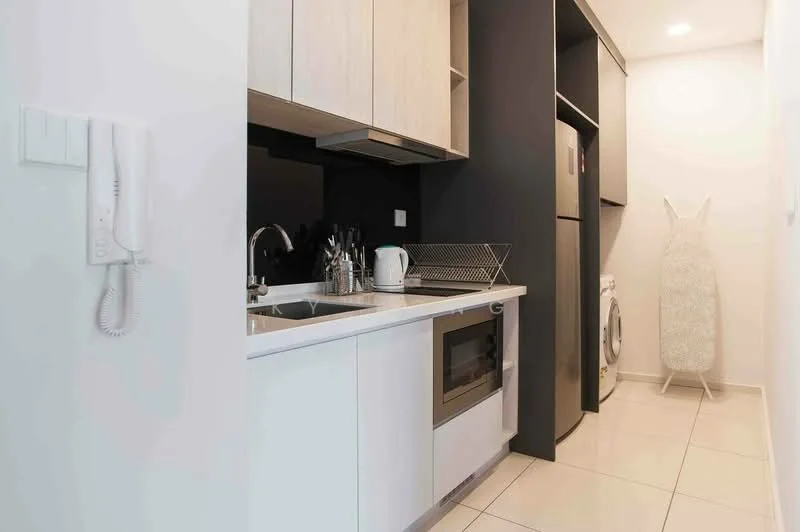 Kitchen features: white cabinetry, black accent wall, stainless-steel sink, chrome pull-down faucet, built-in oven, stainless-steel fridge, front-load washing machine, ironing board, tile flooring, recessed downlights; style: modern.