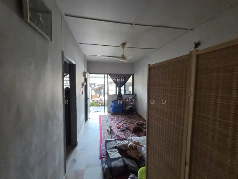 Room features: white painted walls, plain ceiling, ceiling fan, flooring with tiles, window with sheer curtains, partition screen, area rug, seating area with cushions, doorway leading to another room; style: minimalist.