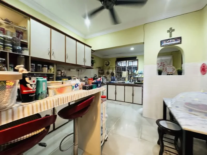 Kitchen features: white painted walls, cream ceiling, marble tile flooring, kitchen island with breakfast bar, red bar stools, wood cabinetry with glass fronts, countertop with jars and containers, built-in oven, stainless-steel sink, chrome faucet, recessed downlights, ceiling fan, window with blinds; style: traditional.