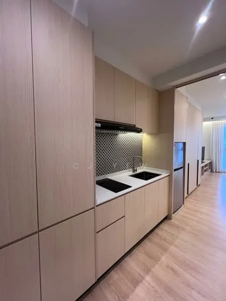 Kitchen features: light wood cabinetry, white countertop, double-bowl stainless-steel sink, chrome pull-down faucet, black backsplash with geometric pattern, built-in oven, freestanding refrigerator, vinyl plank flooring, recessed downlights; style: modern.