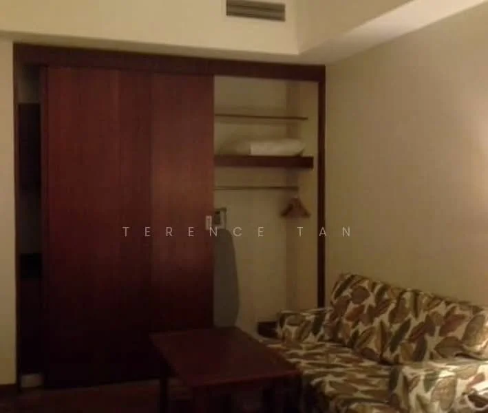 Room features: wooden sliding door, built-in wardrobe with shelves, sofa with floral pattern, wooden coffee table, hanging clothes rack, neutral wall colour, laminate flooring; style: modern.