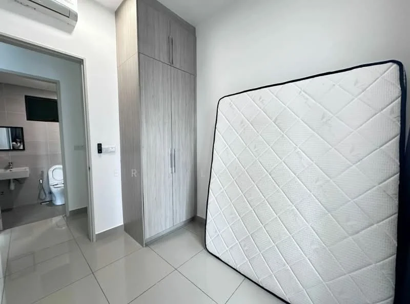Room features: grey laminate cabinetry, white walls, glossy tile flooring, wall-mounted air conditioning unit, single-piece toilet, sink with mirror, mattress leaning against wall; style: modern.