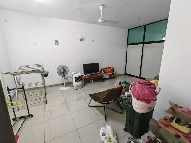 Living features: white painted walls, glossy tile flooring, ceiling fan, wall-mounted TV, brown fabric sofa, folding chair, clothes drying rack, green suitcase, various bags and items scattered, large window with glass panels.