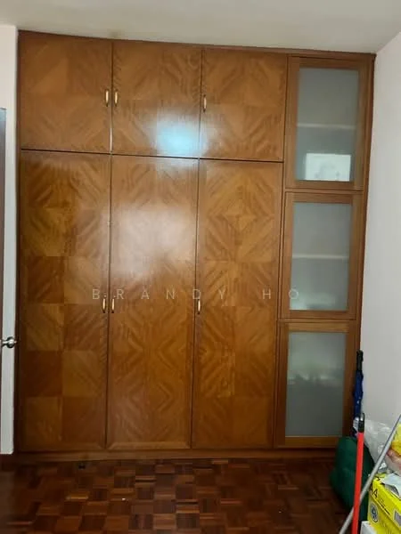 Room features: wooden cabinetry with geometric pattern, glass-front upper cabinets, solid wood lower cabinets, brown wood finish, built-in storage, parquet wood flooring; style: traditional.