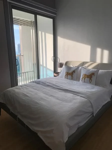 Bedroom features: king-size bed, upholstered headboard, white bedding, two decorative pillows with horse design, floor-to-ceiling windows, balcony access, wooden flooring, nightstand with lamp; style: modern; view: city.