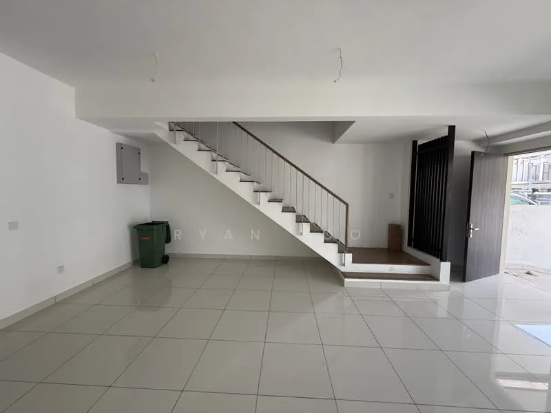 Room features: white painted walls, glossy ceramic tile flooring, staircase with metal railing, built-in storage cabinet, green garbage bin, open space layout, natural light from windows, doorway leading outside; style: modern.