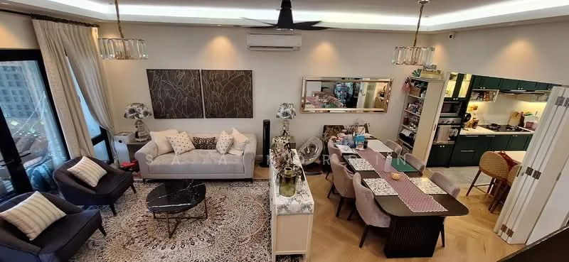 Living features: 5-blade ceiling fan with light, floor-to-ceiling windows, cream painted walls, wooden flooring, sofa in light grey fabric, coffee table with marble top, area rug with intricate pattern, decorative wall art, table lamps with patterned shades, TV console, wall-mounted TV; style: modern; view: city. Kitchen features: green cabinetry, stainless-steel appliances, open shelving, kitchen island with seating, white countertop, built-in oven, freestanding range oven, microwave, refrigerator, pendant lighting; style: modern.