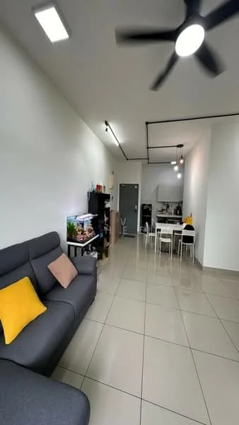 Living features: grey fabric sofa, yellow accent pillow, wall-mounted shelving unit, decorative plants, tile flooring, recessed ceiling lights, 5-blade ceiling fan, open layout, dining area with white table and chairs, kitchen area visible in background; style: modern.
