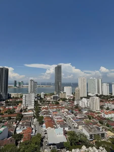 Exterior type: high-rise condominium; features: city skyline view, surrounded by residential buildings, waterfront view, clear blue sky, urban landscape, mixed-use development, high-rise buildings, low-rise residential houses; style: modern.