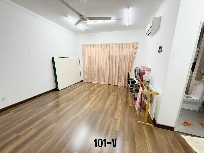 Room features: light wood laminate flooring, white painted walls, ceiling fan, air conditioning unit, large window with sheer curtains, folding table, chair, standing fan, wall-mounted mirror, doorway leading to bathroom, decorative wall feature; style: modern.