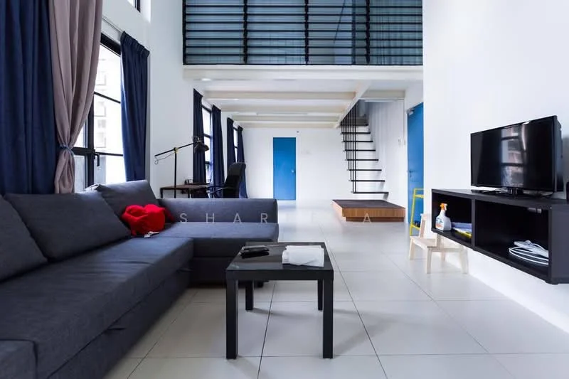 Living features: L-shape sectional sofa in grey, red throw blanket on sofa, coffee table, wall-mounted TV, TV console, floor-to-ceiling windows, blue door, white painted walls, white ceiling, tile flooring, curtains in dark blue, desk lamp, staircase with wooden steps; style: modern.