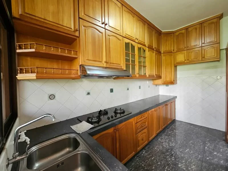 Kitchen features: wood cabinetry, black granite countertop, double-bowl stainless-steel sink, chrome faucet, built-in gas hob, exhaust hood, white tiled backsplash, grey marble flooring, open shelving, glass-front upper cabinets; style: traditional.