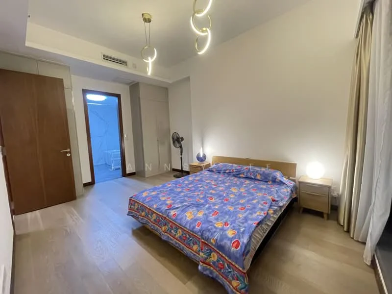 Bedroom features: queen-size bed with colorful bedding, wooden bed frame, nightstand with lamp, ceiling light fixture with modern design, floor-to-ceiling window with sheer curtains, wooden flooring, wall-mounted air conditioning unit, decorative wall with light color, fan; style: modern.