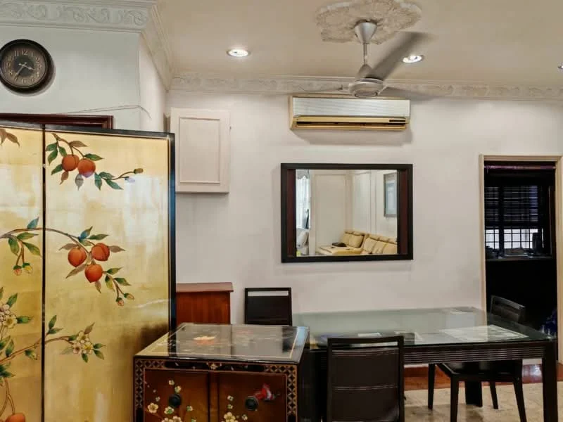 Dining features: glass dining table, black dining chairs, decorative cabinet with floral design, wall-mounted mirror, ceiling fan, wall-mounted air conditioning unit, white painted walls, crown moulding, wooden flooring, clock on wall; style: modern.