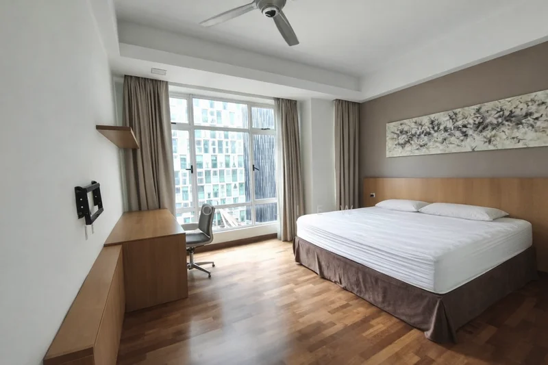 Bedroom features: king-size bed with white bedding, wooden flooring, floor-to-ceiling windows, sheer curtains, wall-mounted artwork, wooden headboard, built-in wooden desk, office chair, ceiling fan, wall-mounted TV, light-colored walls, brown accent wall; style: modern; view: city.