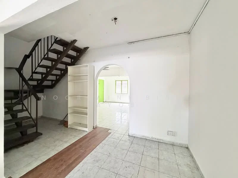 Room features: white painted walls, tile flooring, wooden staircase, built-in shelving unit, arched doorway, window with natural light, ceiling light fixture, open layout; style: minimalist.