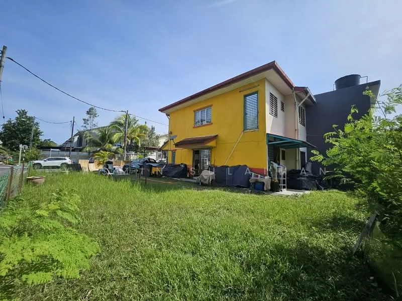 Exterior type: detached bungalow; features: yellow painted facade, two-storey building, green shutters on windows, flat roof, manicured lawn, surrounded by greenery, car porch, outdoor seating area with canopy, fenced perimeter; style: modern.