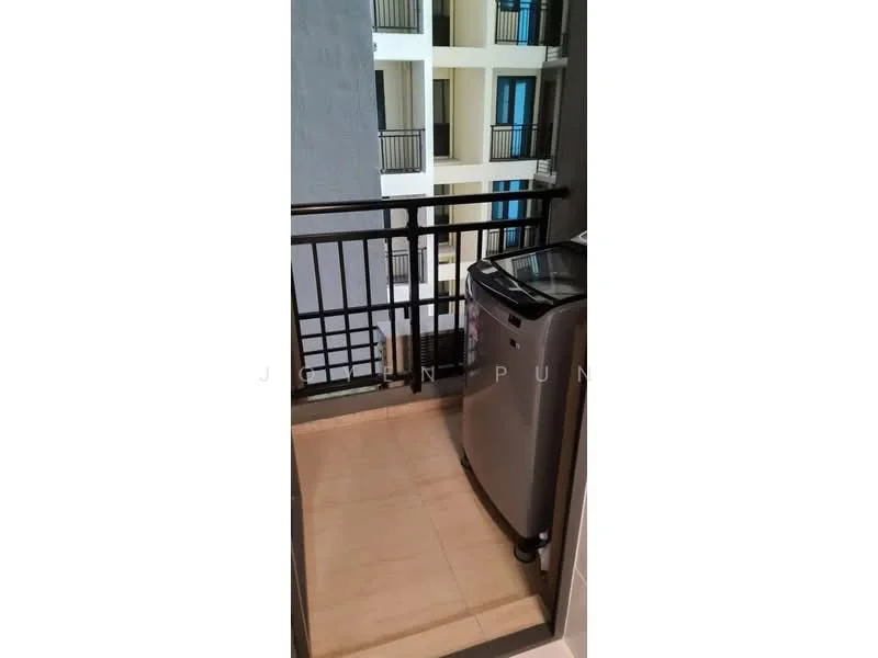 Room features: balcony, grey tiled flooring, black metal railing, washing machine, exterior view of building with balconies.