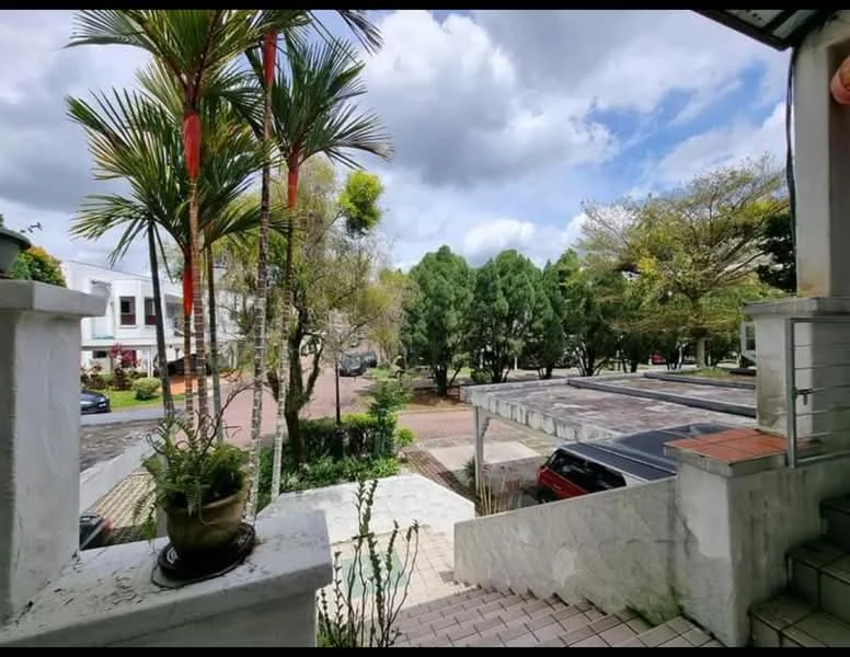 Exterior features: manicured lawn, mature trees, paved walkway, car parking area, surrounded by greenery, residential street view, cloudy sky.