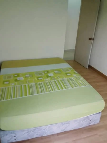 Bedroom features: queen-size bed with green patterned mattress, light wood flooring, plain white walls, single door, window with no visible treatment, minimalist decor; style: minimalist.