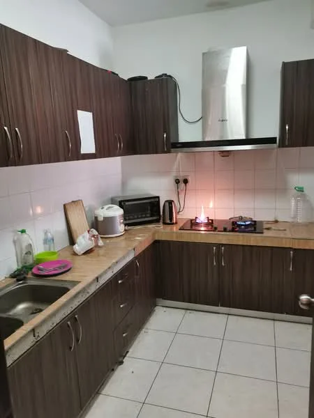 Kitchen features: brown wooden cabinetry, granite countertop, stainless-steel sink, built-in gas stove with two burners, stainless-steel range hood, microwave, electric kettle, rice cooker, white tiled backsplash, white tiled flooring, wall-mounted electrical outlets, fire extinguisher, plastic water bottle; style: modern.