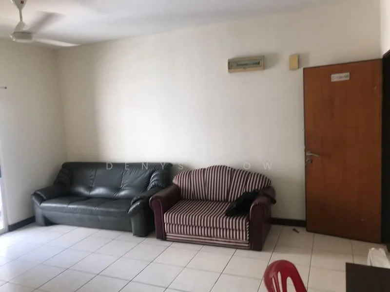 Living features: 2-seater leather sofa in dark green, 3-seater fabric sofa with striped pattern, white painted walls, tile flooring, ceiling fan, wall-mounted split AC, wooden door, window with no visible treatment, red plastic chair.