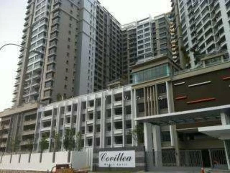 Exterior type: high-rise condominium; features: glass curtain wall, white painted facade, projecting balconies, multiple storeys, landscaped entrance, signage at entrance, parking area visible, modern architectural design; style: modern.