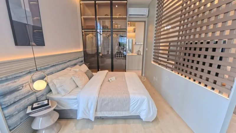 Bedroom features: queen-size bed with light bedding, upholstered headboard, nightstand with lamp, built-in wardrobe with glass doors, wooden flooring, wall-mounted air conditioning unit, decorative wall paneling, soft lighting, framed artwork on wall; style: modern.