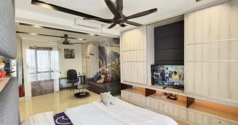 Bedroom features: queen-size bed with white bedding, grey upholstered headboard, built-in wardrobe with sliding doors, wall-mounted TV, wooden TV console, glass partition, ceiling fan with light, recessed lighting, large window with sheer curtains, decorative wall art, study desk with chair, area rug, plush toy on bed; style: modern; view: city.