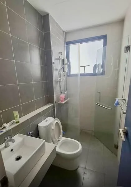 Bathroom features: grey tiled walls, grey tiled flooring, single-sink vanity with rectangular basin, chrome basin mixer faucet, one-piece toilet, walk-in shower with glass enclosure, shower head, wall-mounted shower controls, window for natural light, shelf for toiletries; style: modern.