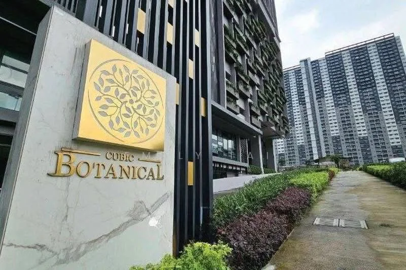 Exterior type: high-rise condominium; features: modern facade with greenery, golden signage with floral design, landscaped pathway, manicured hedges, surrounding high-rise buildings, concrete walkway; style: modern.