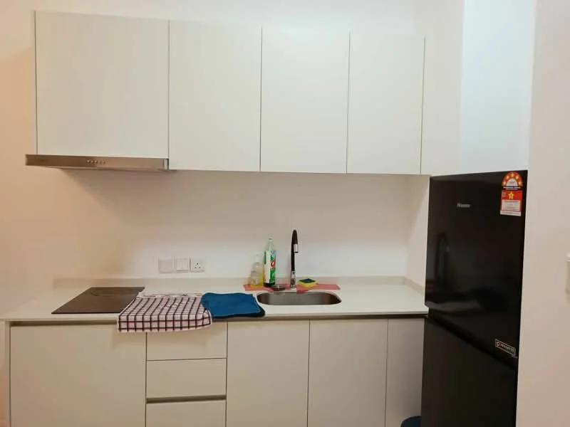 Kitchen features: white cabinetry, stainless-steel sink, chrome pull-down faucet, black fridge, built-in cooktop, white countertop, dish towel, kitchen towel, bottle of dish soap, cleaning spray; style: modern.