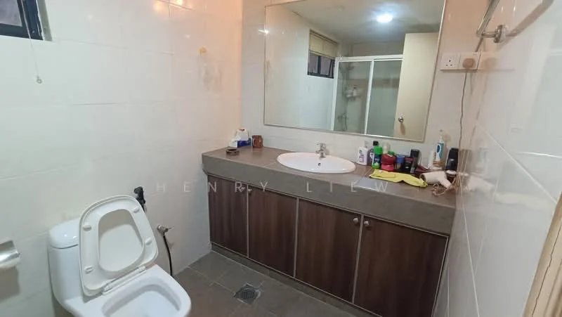 Bathroom features: white tiled walls, grey tiled flooring, single-sink vanity with wood cabinet, round mirror above sink, chrome basin mixer faucet, toilet, glass shower enclosure, shower head, various toiletries on countertop, built-in cabinet under sink; style: modern.